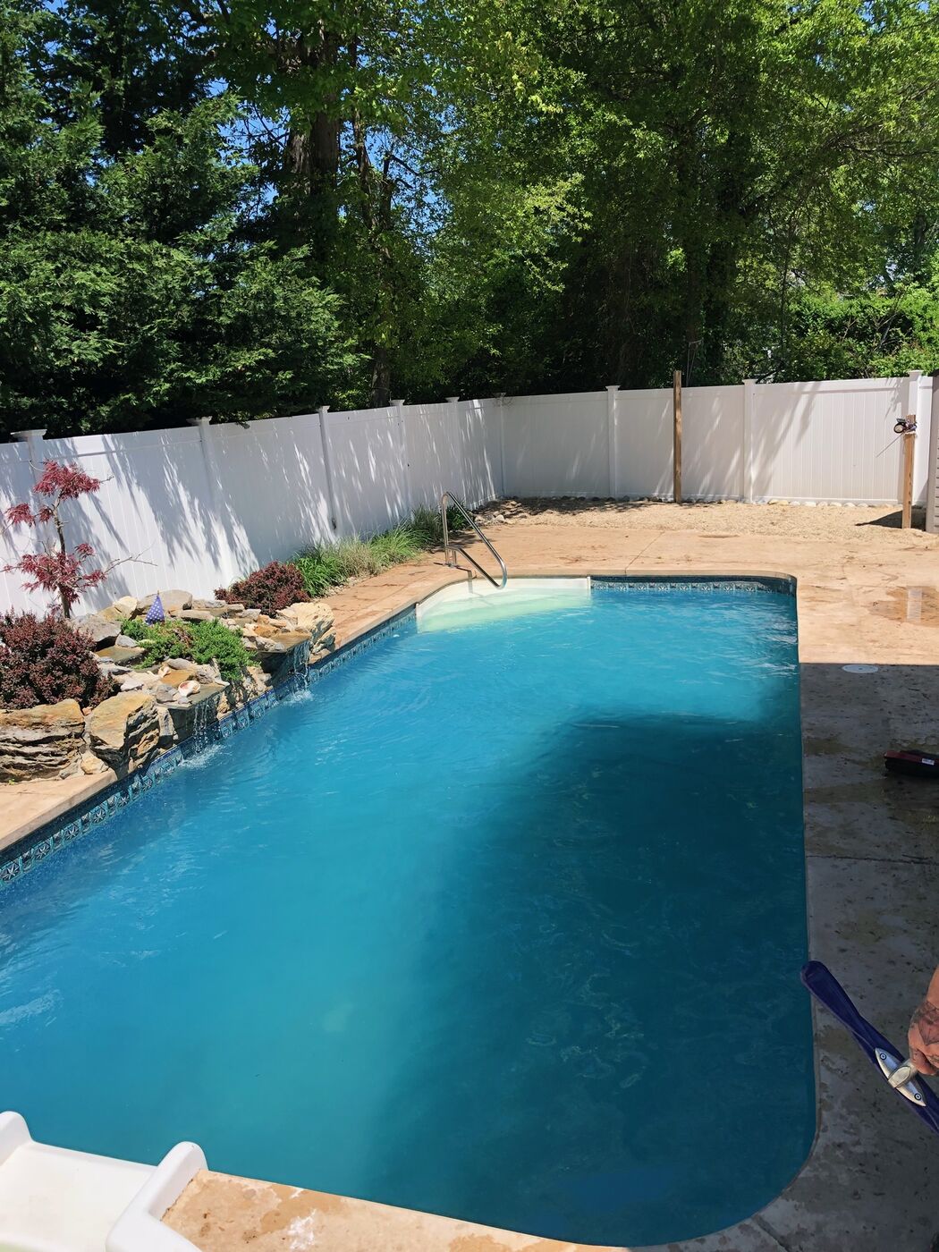 The same pool restored to clear blue water after service